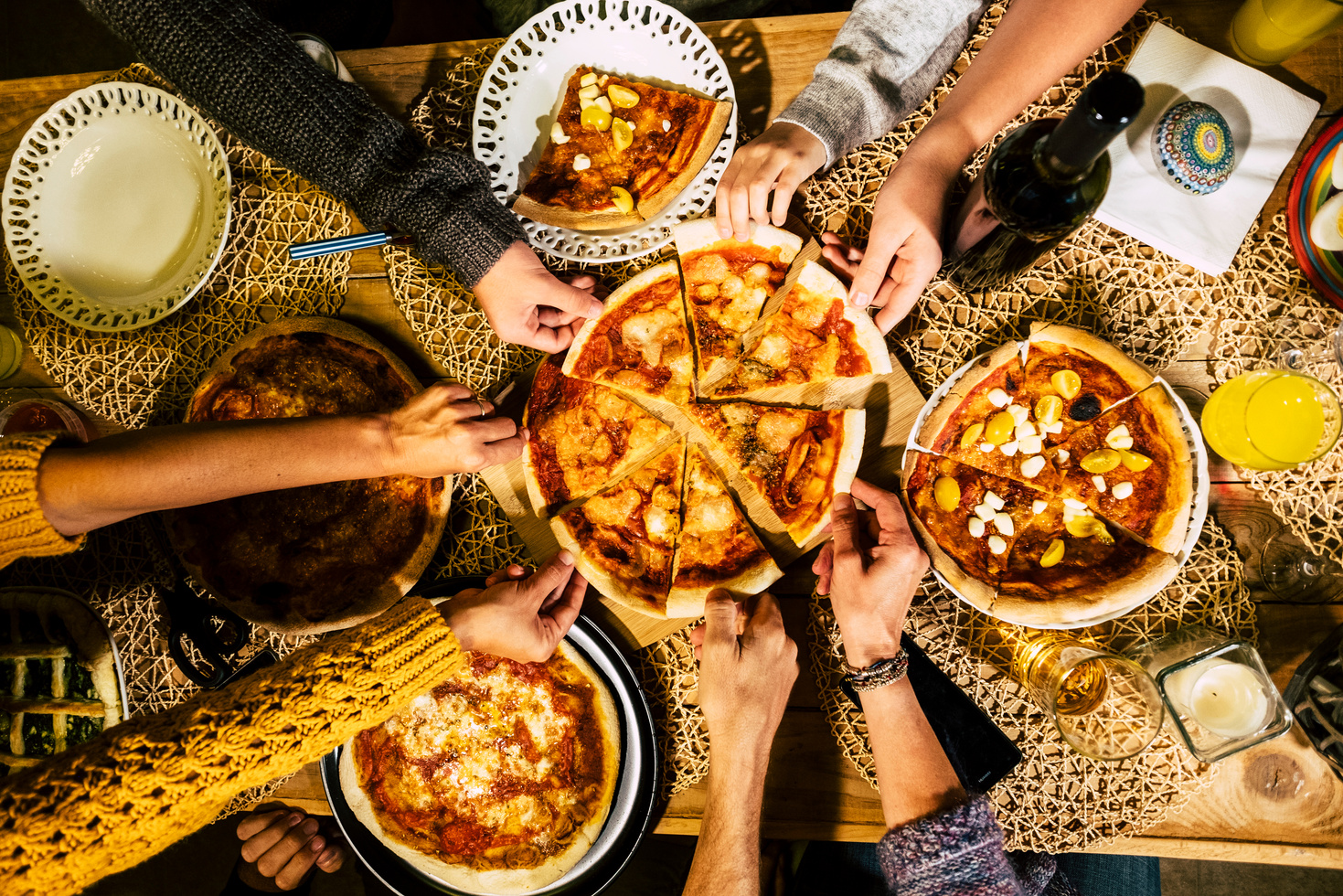 Group of People Eating Pizza